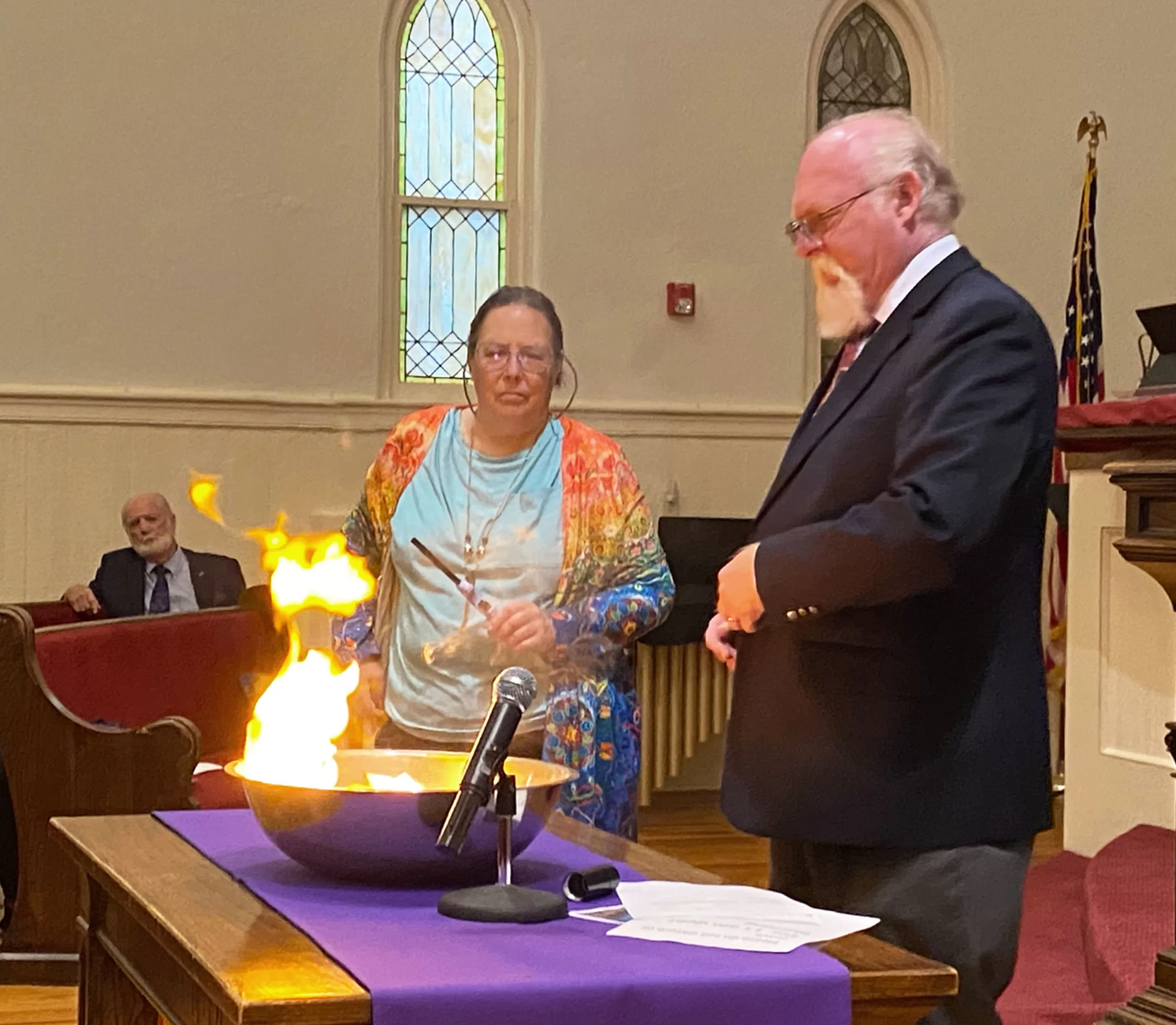 The Rev. John Jackman symbolically burn the medical debt of thousands of families